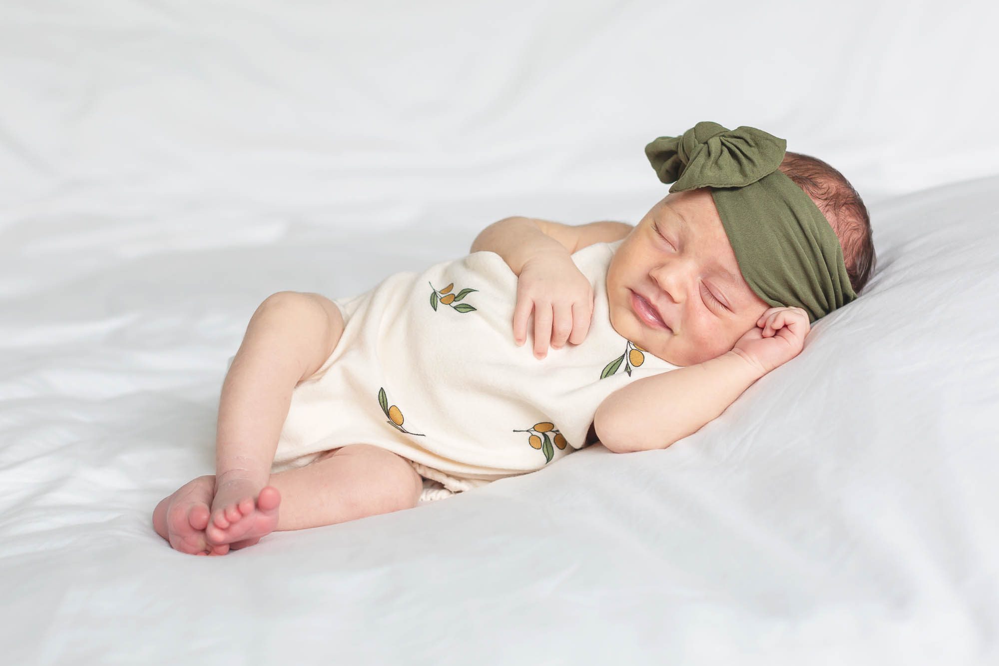 new baby sleeping and smiling