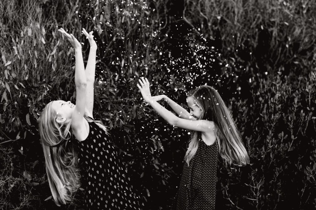 Happy photography clients throwing glitter